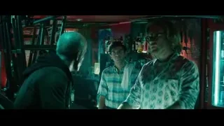 three men conversing in dimly lit bar — Deadpool 2