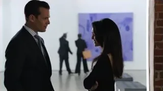 man and woman talking in art gallery — Suits