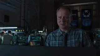 man in industrial space with NASA banner — The Avengers