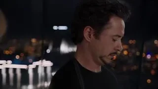 close-up of man with cityscape at night — The Avengers
