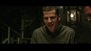 young man in green shirt in dim room — Now You See Me 2