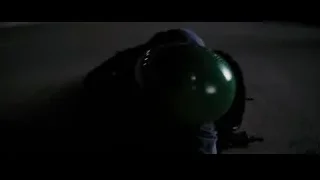hand holding green balloon — Batman: The Dark Knight Rises