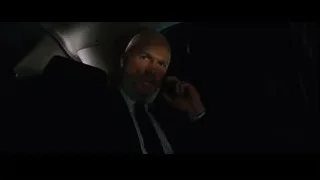 bald man talking on phone in car — Iron Man