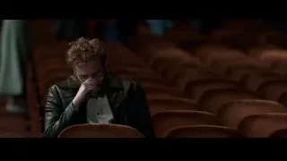 man deep in thought in empty auditorium — Steve Jobs