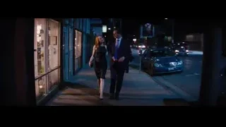 man and woman walking on street at night — La La Land
