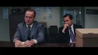 two men in suits at office desk — The Wolf Of Wall Street