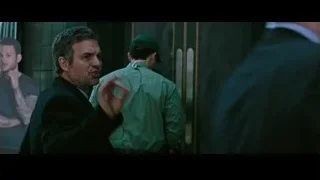 man in suit walking with uniformed men — Now You See Me 2