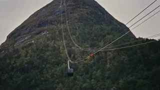 cable car going up mountain — Succession
