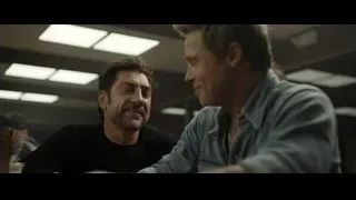Two men talking at restaurant table — F1