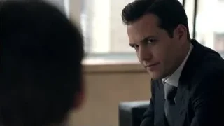 man in suit sitting at desk deep in thought — Suits