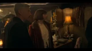 man in black suit and hat with woman — Peaky Blinders