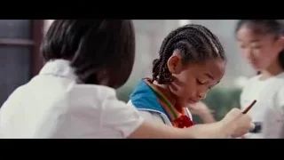 young girl writing in school uniform — The Karate Kid