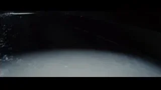 Man working on computer in dimly lit lab — The Amazing Spider Man