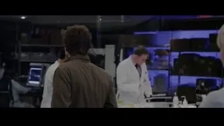 young man and woman conversing in laboratory — The Amazing Spider Man