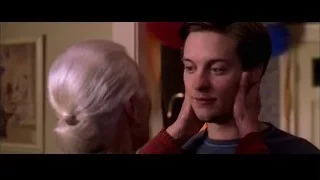 man covering face with hands near woman — Spider Man 2