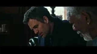 two men talking in dimly lit room — Now You See Me 2