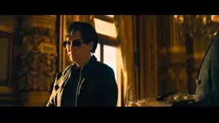man in black jacket in ornate room — John Wick: Chapter 4