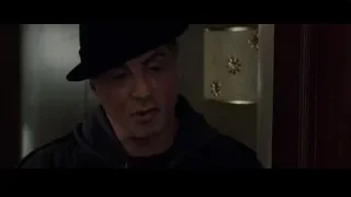 elderly man with closed eyes in dim room — Creed