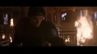 man with head down in dark room — Batman