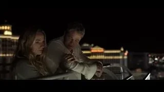 couple on balcony overlooking city at night — F1