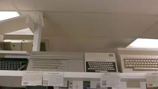 Old-fashioned typewriters on white shelf — Screened Out