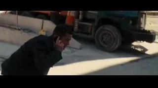 man on phone near cement mixer truck — Batman: The Dark Knight Rises