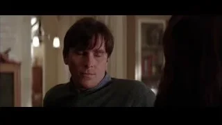 man and woman in dimly lit living room — Batman