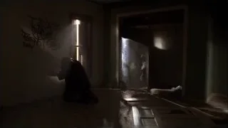Person kneeling in abandoned room with flashlight — Breaking Bad