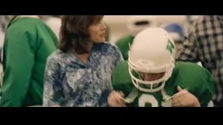 Upset young boy on couch with head in hands — The Big Short