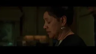 Woman with closed eyes in dim room — Creed 3