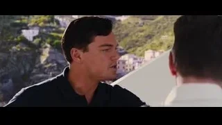 two men on balcony overlooking city — The Wolf Of Wall Street