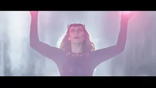 woman with crown and raised arms in fog — Doctor Strange 2