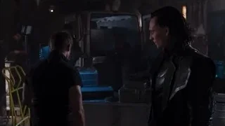 man holding gun in dimly lit room — The Avengers