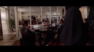 men in suits at restaurant table — American Psycho