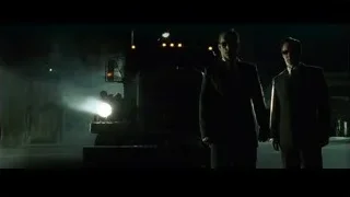 three men in suits by truck at night — The Matrix