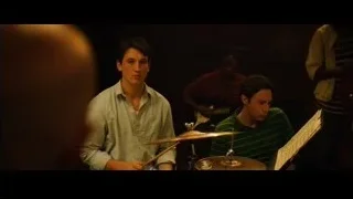 Young man playing drums with musicians — Whiplash