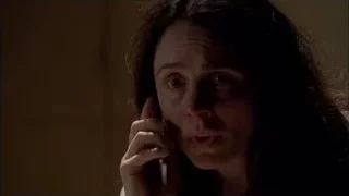Young woman talking on phone in dark — Breaking Bad