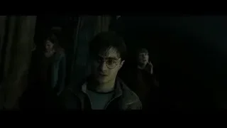 destroyed building with burning torches at night — Harry Potter and the Deathly Hallows 2