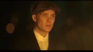 man's face in flat cap and suit — Peaky Blinders