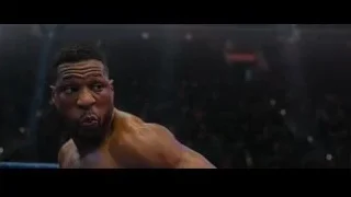 muscular man fighting in boxing ring — Creed 3