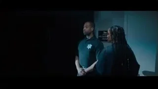 people in dimly lit room — Creed 2
