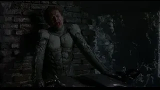 man in futuristic suit holding sword — Spider Man