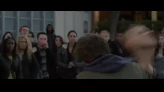 Person in green jacket lying unconscious — The Amazing Spider Man