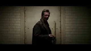 man with glasses at large metal door — Batman: The Dark Knight