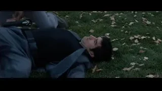 man kneeling on grass with fallen leaves — Iron Man 3