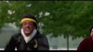 man running in park with trees — Rocky III
