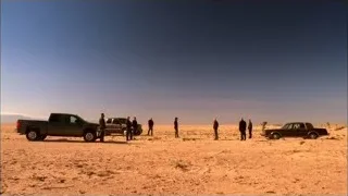 people conversing in desert with cars — Breaking Bad