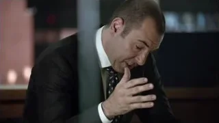 man in suit thinking at office desk — Suits