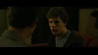 young man sitting on red couch — The Social Network