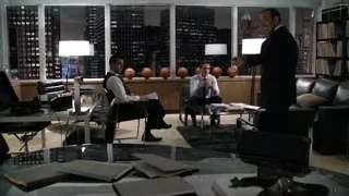 Three men in modern office meeting — Suits
